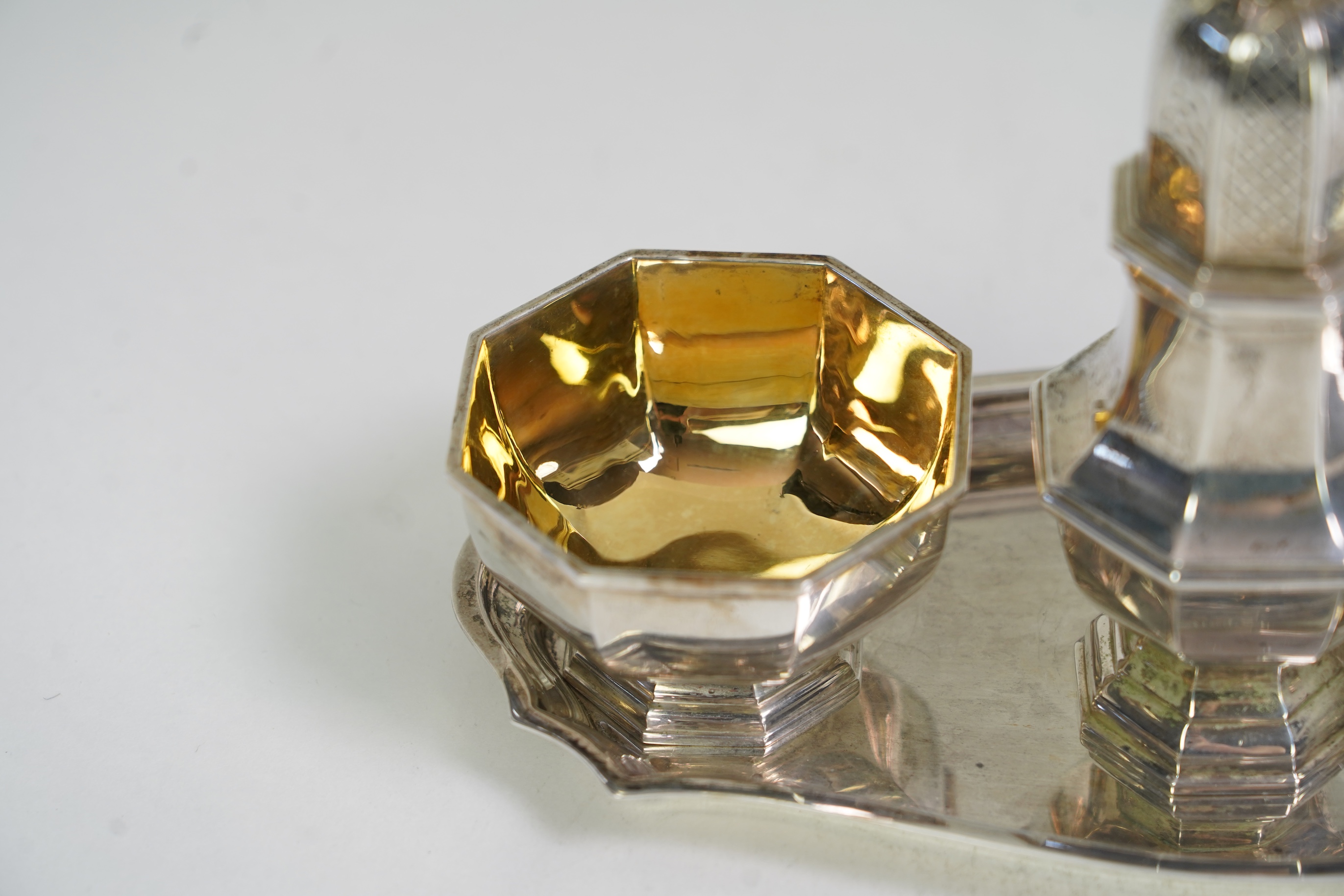An Elizabeth II Asprey & Co silver three piece condiment set on stand
